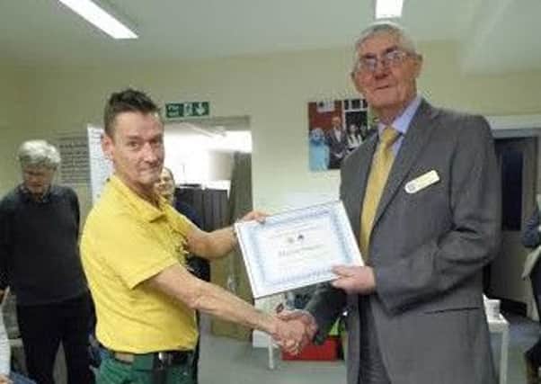 A Hope Community service user receiving his award from the Rotarinas of Retford