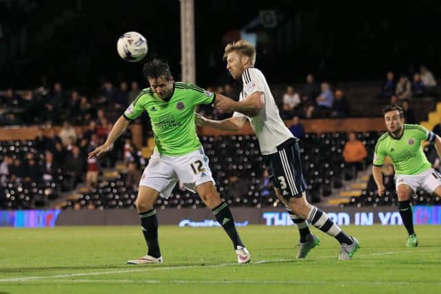 Fulham defender Dan Burn in action against Sheffield United in the Capital One Cup