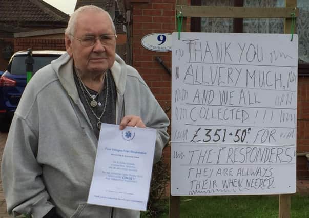 Sid Burgess with his certificate from the Five Villages Responders and his own thank you sign outside his house