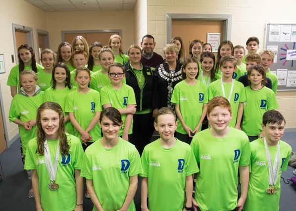 Worksop Dolphins swimming team have received funding from Asda towards their kit