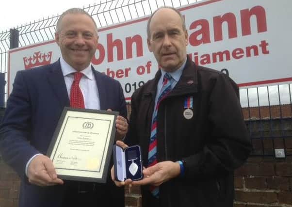 Bassetlaw MP John Mann (left) with Worksop Help for Heroes fundraiser Tony Eaton with his British Citizen Award.