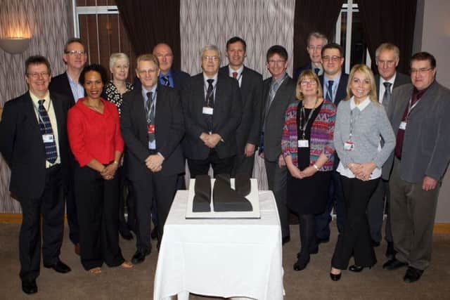 Staff and governors celebrate the merger deal between North Notts College and Rotherham College