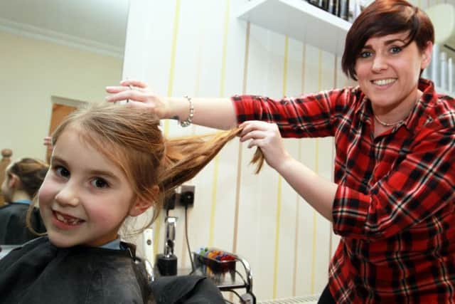 Maisie Priestley, six, had her hair cut for the Little Princess Trust. Maisie is pictured with Sarah-Jayne Heath from Roscoe's in Worksop.