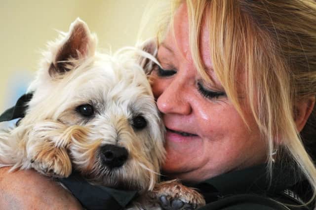 Jerry Green dog rescue centre volunteer, Gill Skinner, with Oscar, the Westie that she has adopted.
