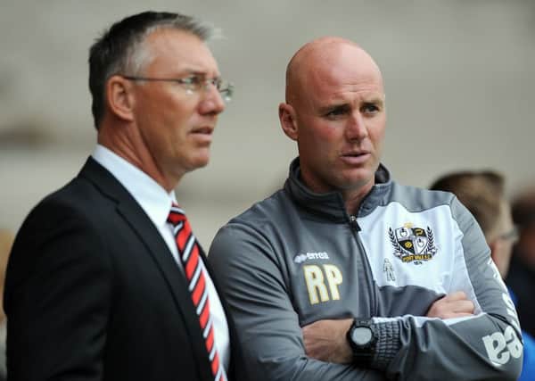 Nigel Adkins is preparing his team for tomorrow's game against a Port Vale team managed by Robert Page (right) 
 
Â©2015 Sport Image all rights reserved