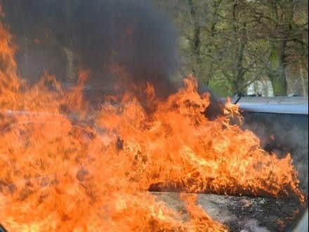 Firefighters tackle a car fire in a car park in Chapel. Credit: Nigel Pickover