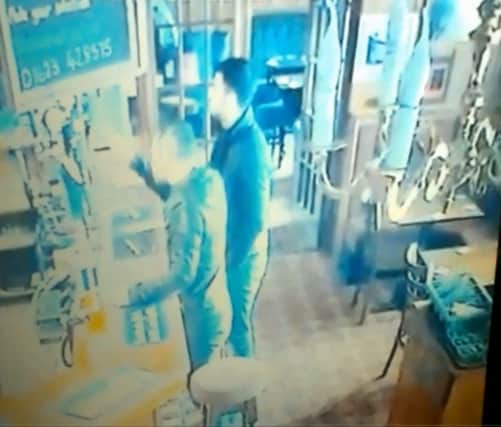 A screenshot of CCTV  footage from the Pheasant Inn pub in Mansfield where thieves stole a charity box from the bar