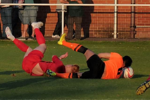 Sam Liversidge caught, and injured, in the first minute against Clipstone