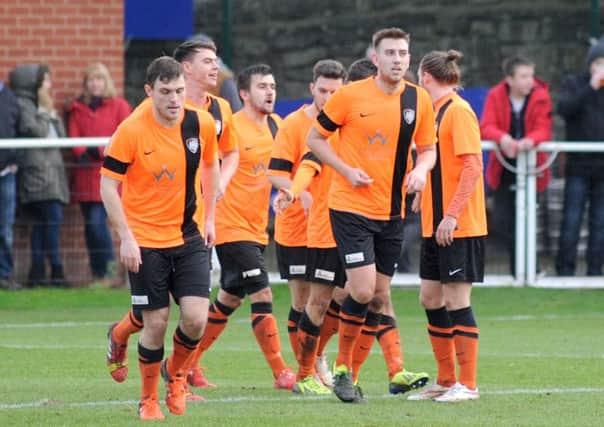 Worksop Town v Pontefract Colliers.   
The Tigers return to the kick-off spot after their first half goal.