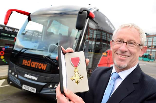 Ian Morgan with his OBE awarded for services to public transport and the community : Photograph by Lionel Heap