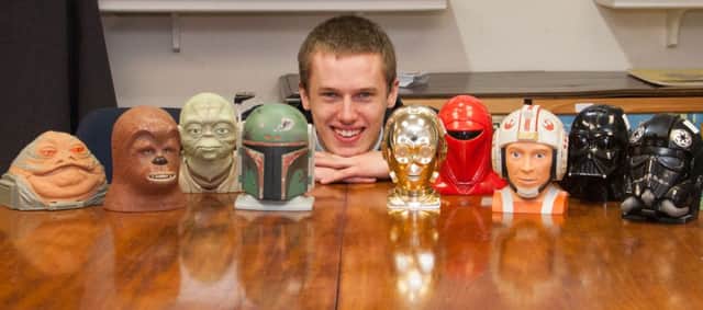 A rare collection of Star Wars toys is set to go under the hammer in Derbyshire next month. Pictured is David Wilson-Turner Hansons Auctioneers' Salesroom Porter with some of the toys.