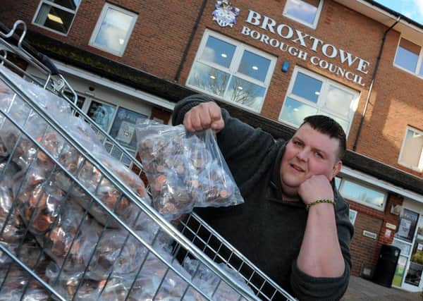 Russell Skellett delivers Â£1,850 in pennies to Broxtowe Borough Council offices to pay council tax on two properties that he owns.