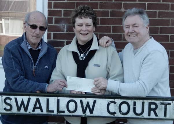 Coun Hazel Brand has presented a cheque for Â£50 to Cedric Hancock and Geoff Richardson.
