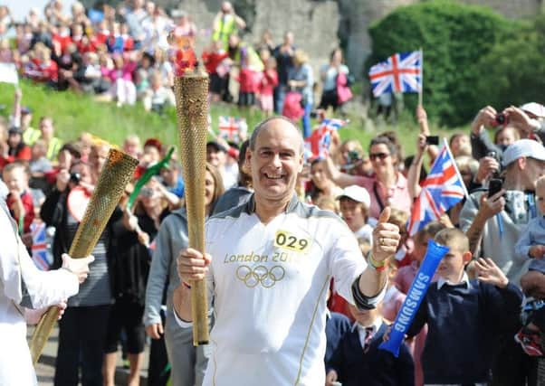 Olympic Torch bearer Tony Eaton arrives in Castle Hill, Conisbrough