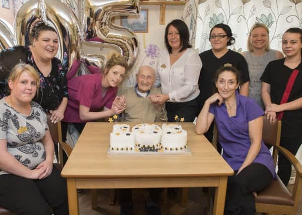 George Arnold celebrates his 105th birthday with staff at the Victoria Care Home in Worksop