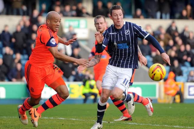 Alex Baptiste, left, in action for old club Bolton Wanderers against one of his new team mates Martyn Woolford