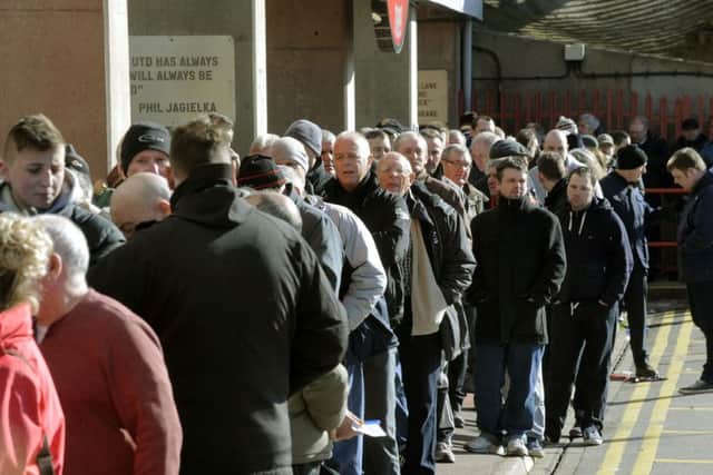 Sheffield United supporters queue for tickets
