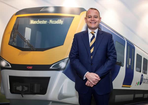 Alex Hynes, Managing Director of Northern, with a visualisation of a new-look Northern train on the first day of the Northern Franchise