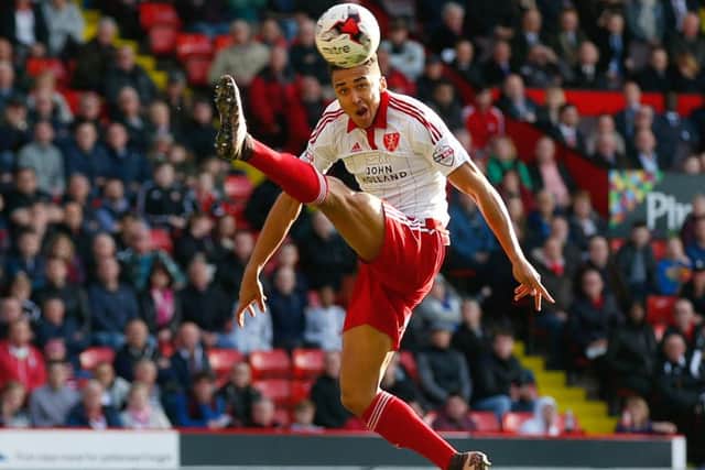 Dominic Calvert-Lewin of Sheffield Utd takes the ball out of the air against Crewe