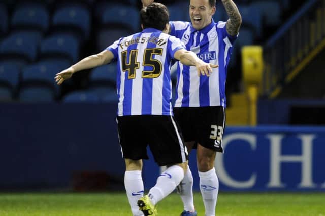 Ross Wallace celebrates the second goal with Fernando Forestieri