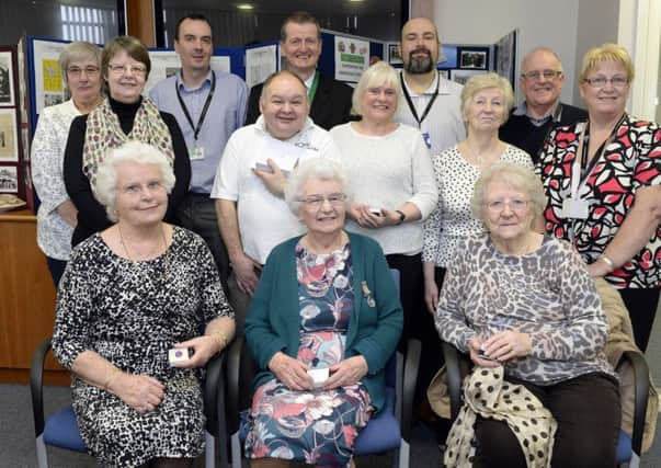 Volunteers from the shop at Bassetlaw Hospital, Worksop receive awards for their years of service there