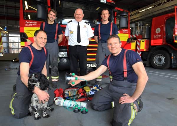 Derbyshire Fire and Rescue have been donated oxygen masks for animals when they carry out animla rescues. Pictured at Chesterfield Community Fire Station with the new masks are Greg Fletcher, Ed Lowe, Bob Curry, Mick Clark, Jaimie Hammond and Dexter. Photo: Chris Etchells