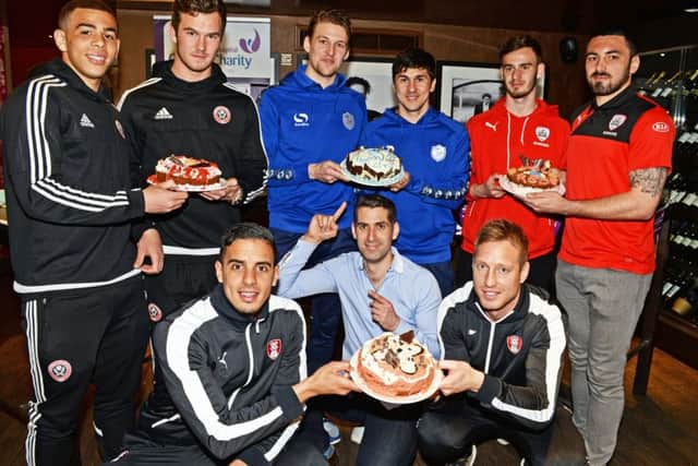 Sky Sports HQ's David Garrido pictured with Harrison McGahey and Che Adams of Sheffield United, Glenn Loovens and Fernando Forestieri from Sheffiled Wednesday Callum Evans and Nick Townsend Barnsley FC and Aimen Belaid and Luciano Becchio from Rotherham United at the Weston Park Hospital Charity Time for Tea Cake Off