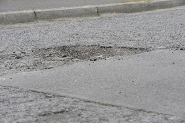 Potholes and uneven surfaces on Christina Hill, Cinderhill