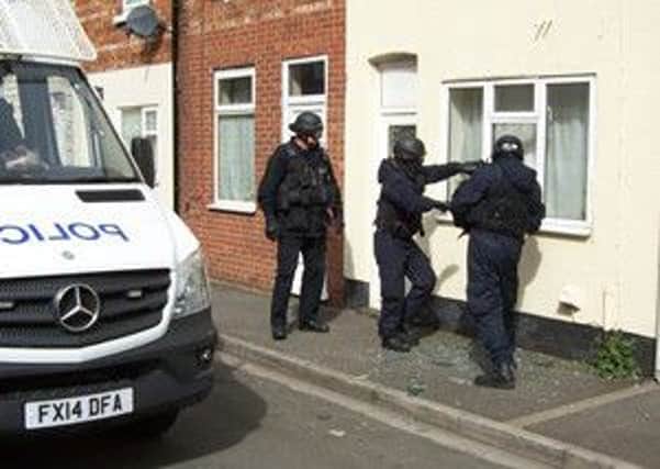 Officers carrying out one of the Gainsborough warrants