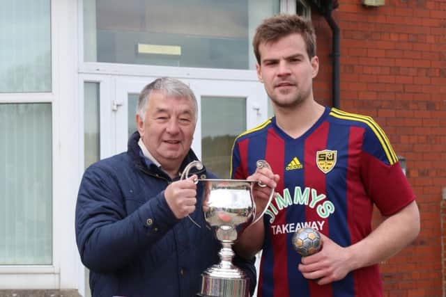 St Josephs captain Chris Rawson was presented with the cup by the Leagues fixtures and referees secretary Dave Northage.