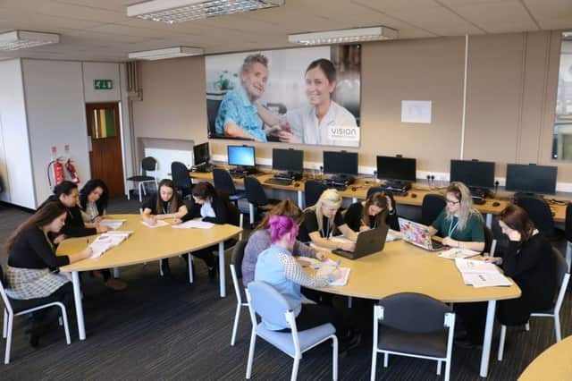 Level 3 Health and Social Care students in Year 12 working on a vocational-related project in the schools project room at Vision Studio School in Mansfield