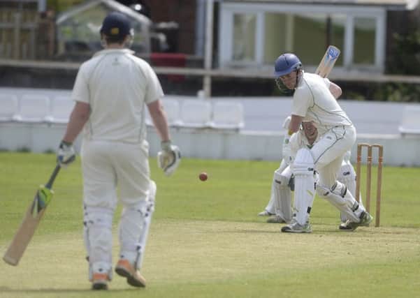 TAYLOR-MADE DEFIANCE -- batsman Harry Taylor tries to salvage Worksops innings in their heavy defeat against Farnsfield in The Championship.