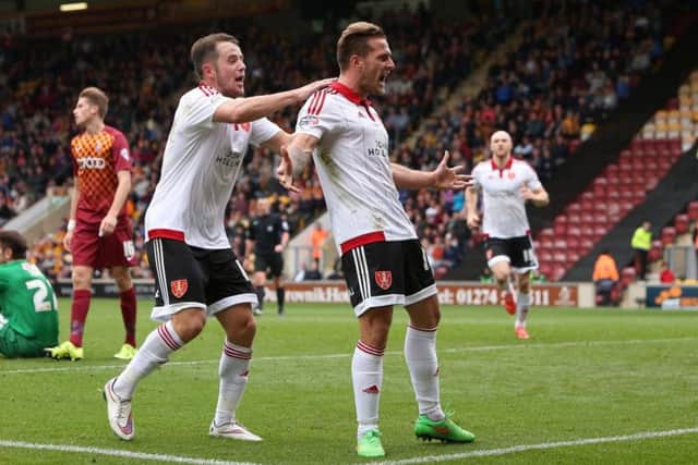 Billy Sharp celebrates his goal against Bradford City with Marc McNulty
