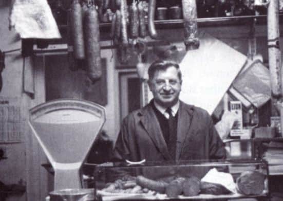 Mr Nowak is pictured in his shop on Hardy Street