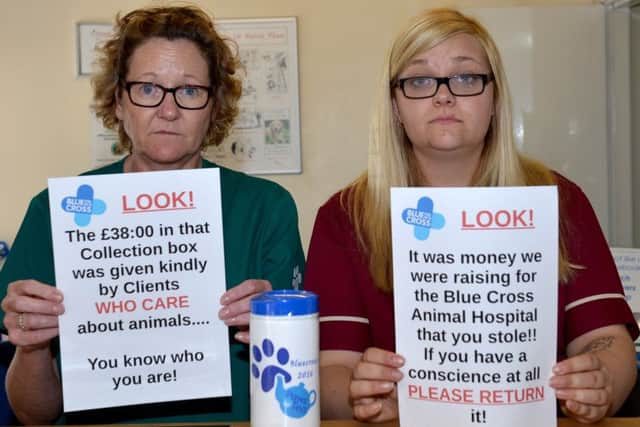 Thieves broke into VetSavers, Worksop and stole the Blue Cross collection box, pictured are from left Suzhy Winfield and Alex Munchie
