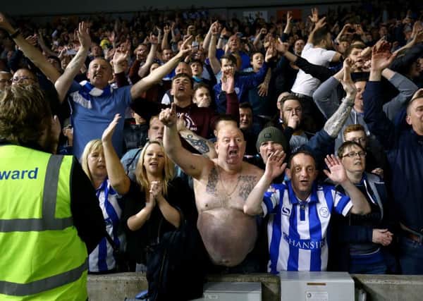 Sheffield Wednesday's fans celebrate in the stands after the final whistle