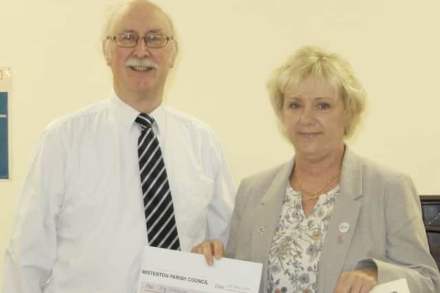 Joy Johnson receives her Misterton Citizen of the Year Award from Bary Cooper, Parish Council chairman