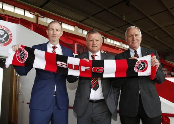 Chris Wilder is flanked by his assistant Alan Knill and co-owner Kevin McCabe 
Â©2016 Sport Image all rights reserved