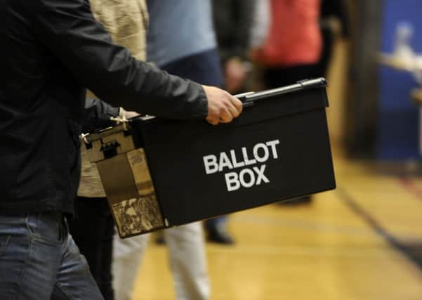 Ballot boxes are carried into the hall at the Richard Dunn Centre, Bradford,  for counting in the 2015 General Election.  7 May 2015.  Picture Bruce Rollinson