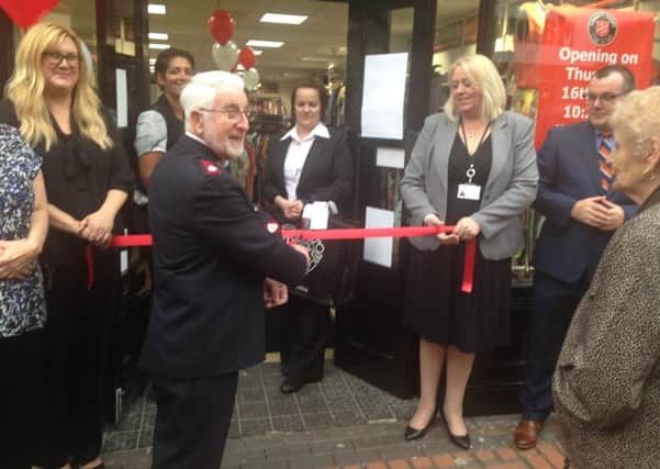 Major Ray Mackereth cuts the ribbon to officially open the new Salvation Army shop in Retford
