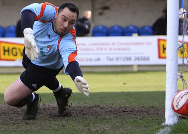 Buxton FC v Worksop, Worksop keeper Jon Kennedy watches a shot just miss his goal