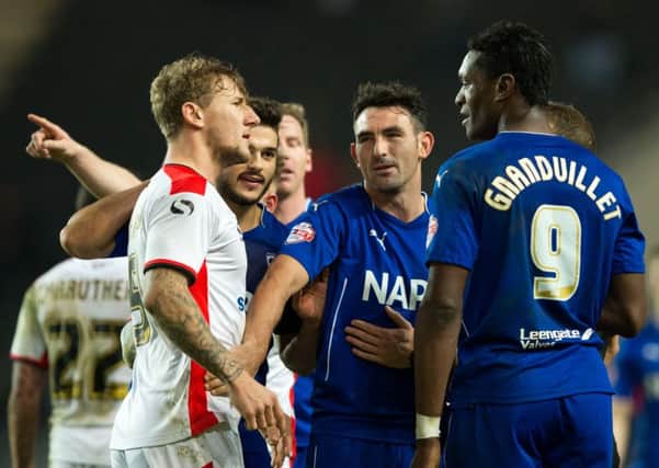 Kyle McFadzean (left) has reportedly asked to leave MK Dons