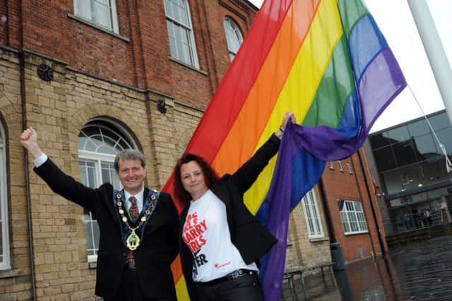 Bassetlaw District Council chairman, Coun. Jim Anderson and Worksop Pride organiser, Crystal Lucas pictured at the LGBT flag raising ceremony in Worksop on Wednesday.