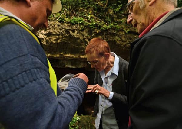 Archaeologists from Durham University on a dig at Anston Stones, pictured is Coun Christine Sadler examining some pottery found by the archaeologists