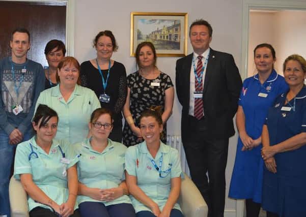 Health Care Assistants and the Skin Integrity team with Rick Dickinson, Deputy Director of Quality and Governance (third right) and Mike Oldfield, Health Care Assistant is fifth left.