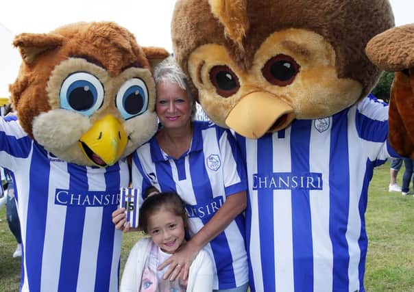 Sandy Cutts and Millie get up close to Barney and Ozzie Owl at last year's Owls in the Park