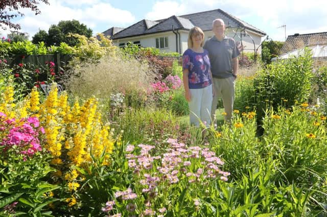 Open gardens, Terry and Eileen Kelly in their back garden