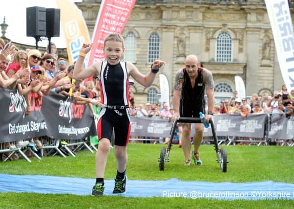BBC Sport Personality of the Year winner, Bailey Matthews returns to the Castle Howard Triathlon, where he won the hearts of the nation last year by casting aside his walking frame to finish the race. Bailey is nine years old and has cerebral palsy.  Helped by his dad Jono and Uncle John Hardcastle.
23 July 2016.  Picture Bruce Rollinson