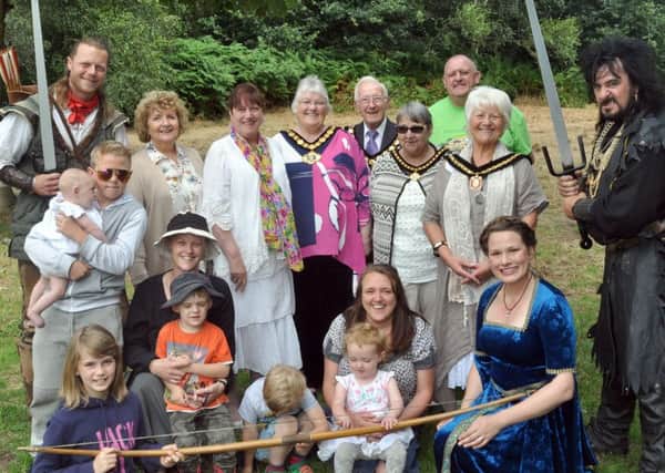 Visitors to the 32nd annual Robin Hood Festival including local dignitaries, join Robin Hood (Steve Warrington) and the Sheriff of Nottingham (Mark Williams) after the opening ceremony on Monday.