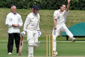 LUNG-BUSTER -- bowler Tom Lungley puts everything into his bowling for Welbeck in a local derby against Mansfield Hosiery Mills.